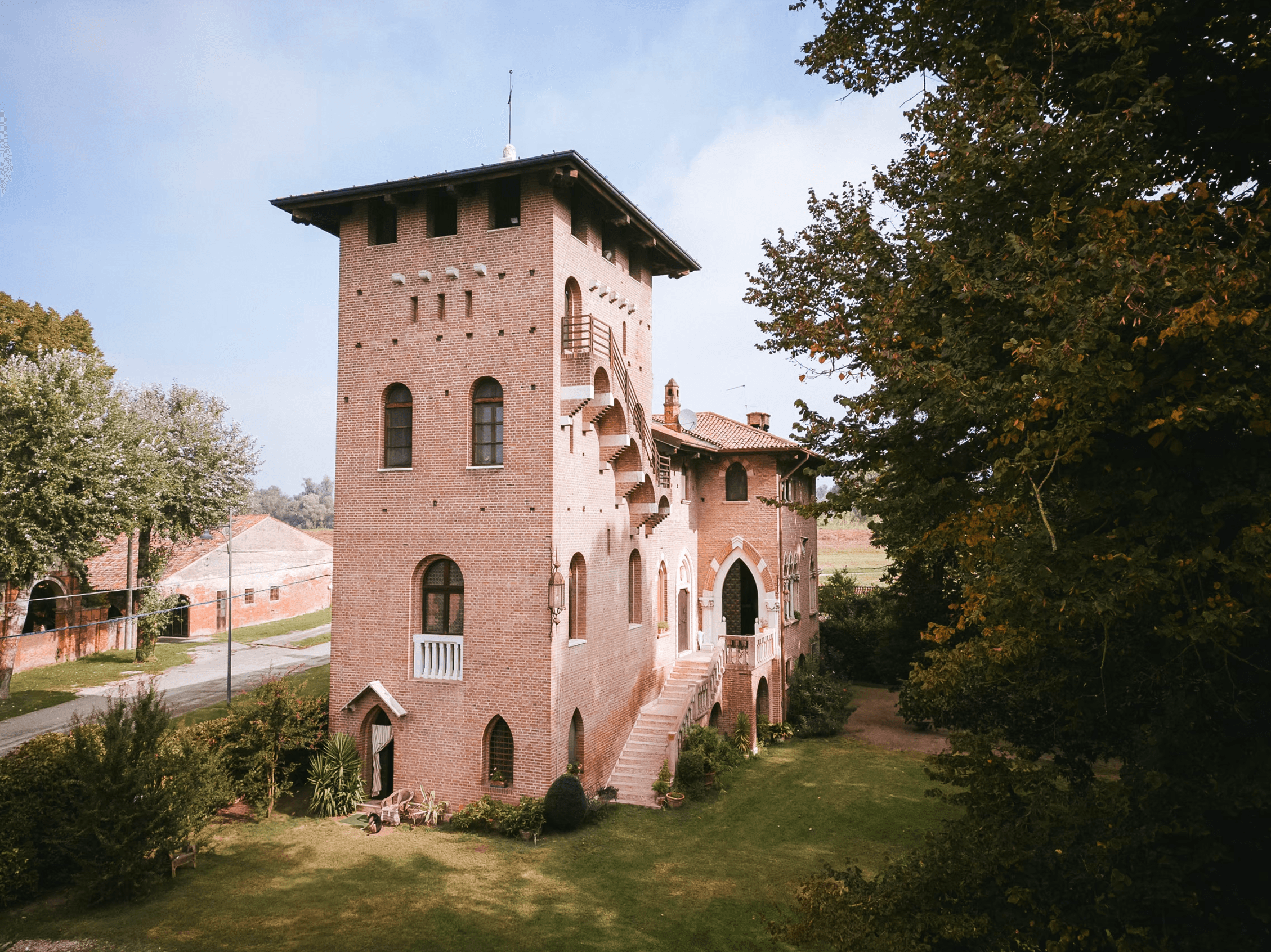 The brick tower and gardens beside the villa